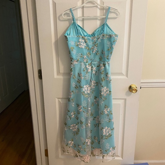 Turquoise Dip Hem Dress with Adjustable Straps and Removable Bra Padding - Picture 2 of 4